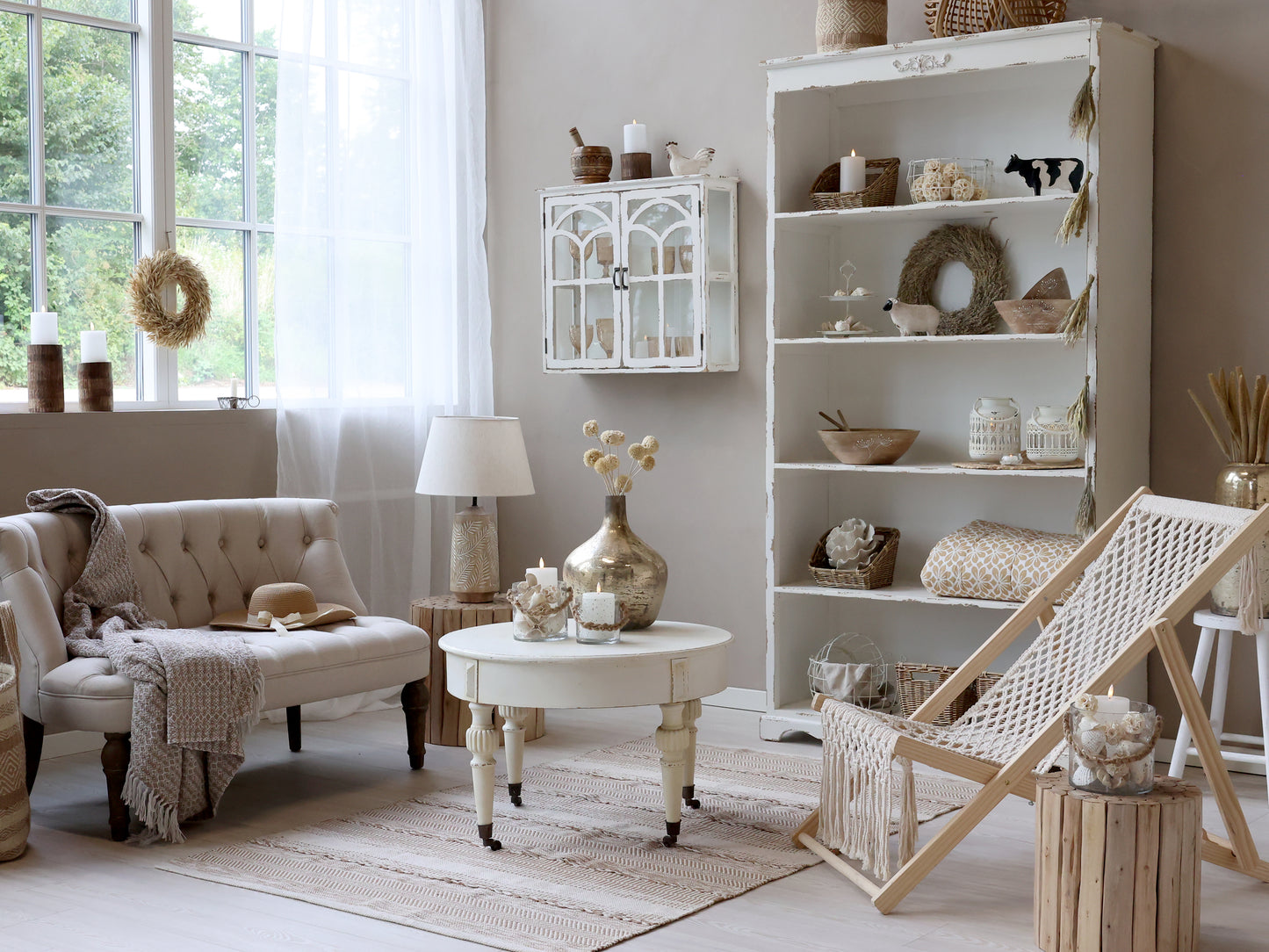 Cozy living room with a bookshelf, sofa, and decorative items.