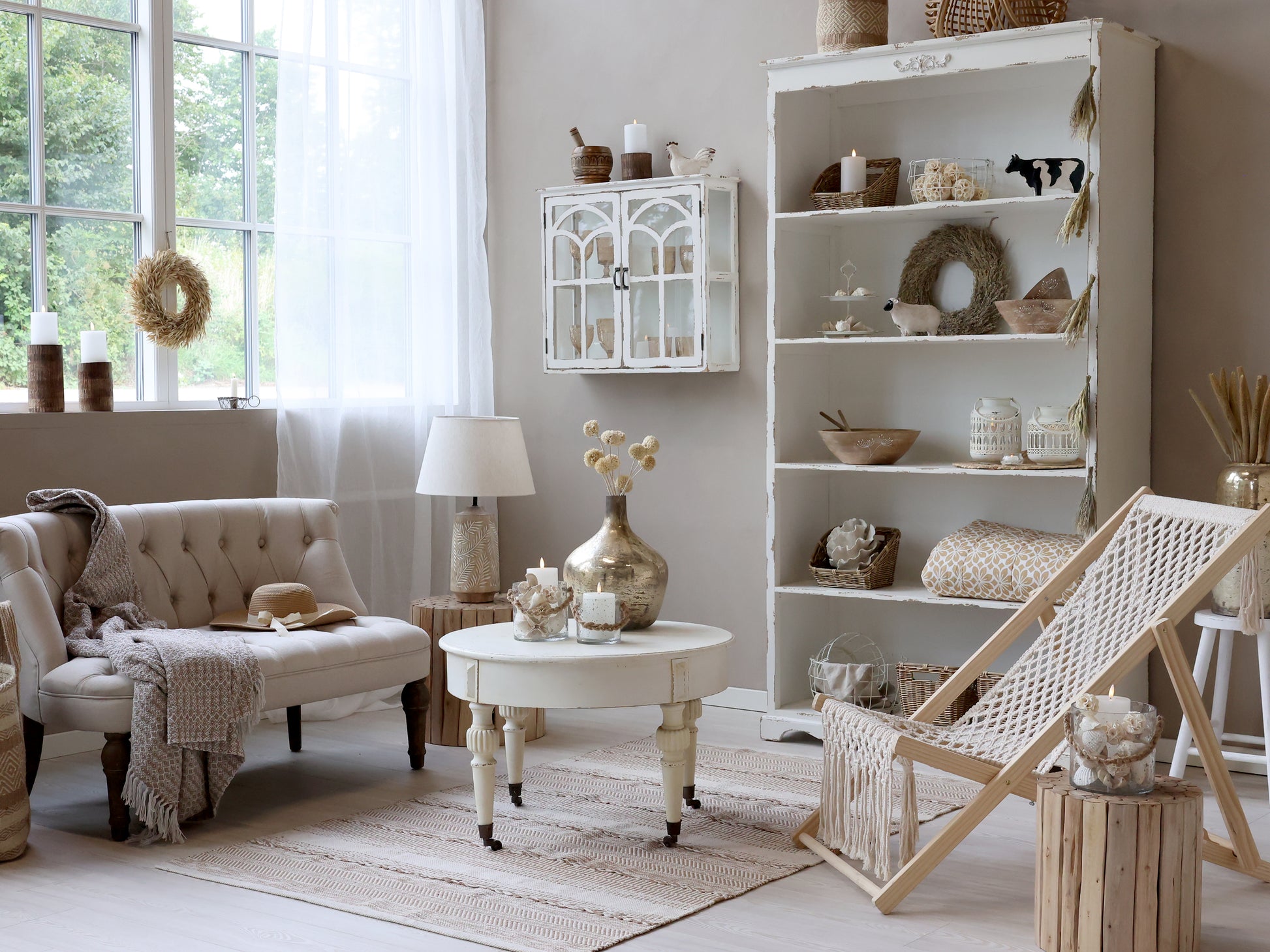 Cozy living room with a bookshelf, sofa, and decorative items.