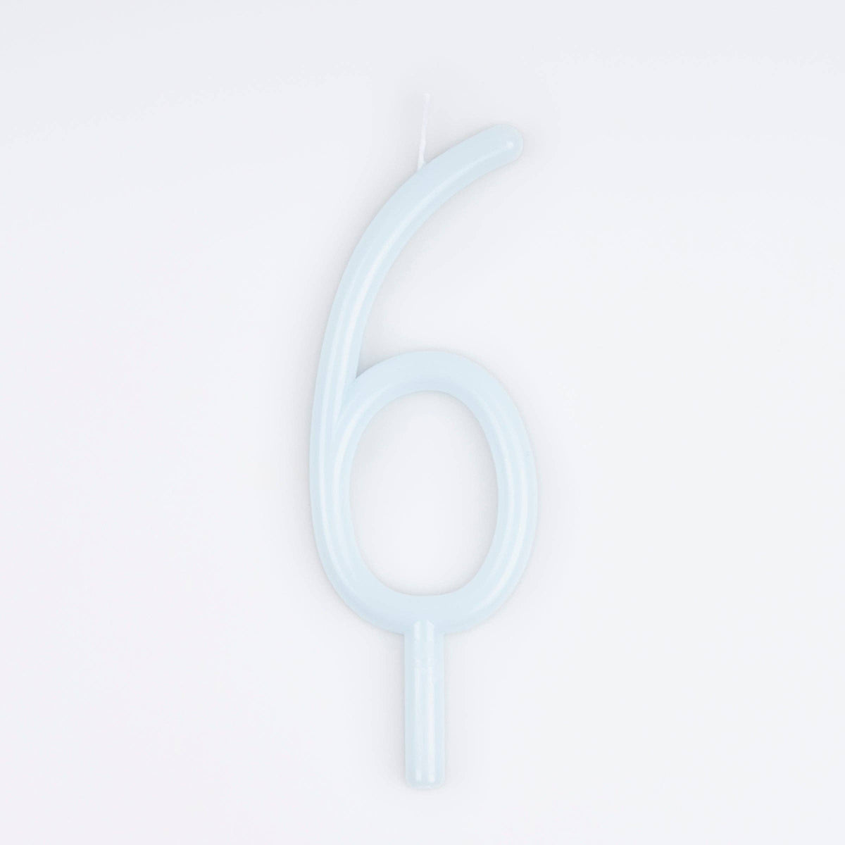 A single pale icy blue birthday candle shaped like the number six, shown on a clean white background.