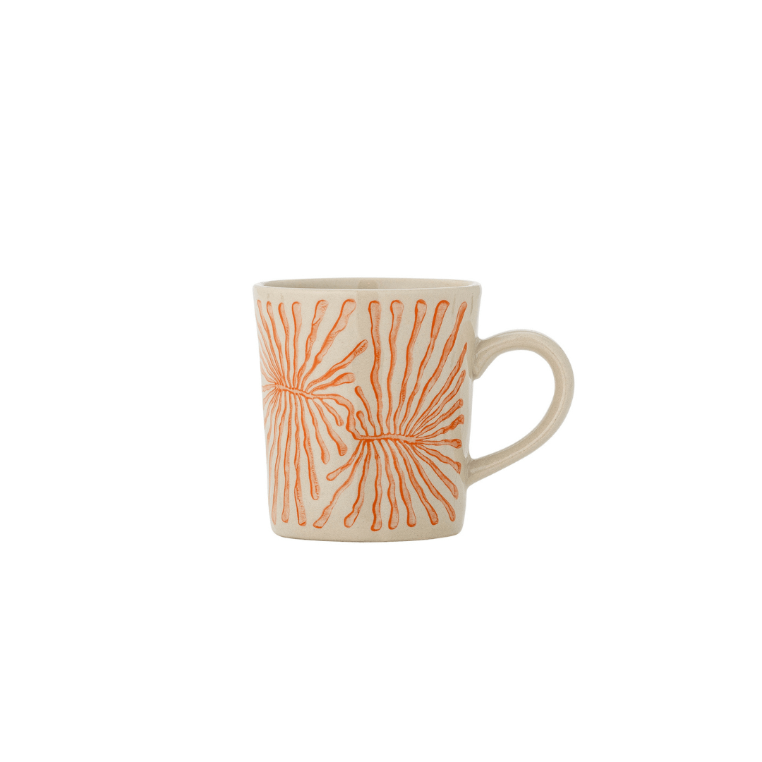 A ceramic mug with a warm cream-colored glaze and an orange hand-painted sunburst pattern, shown against a plain white background.