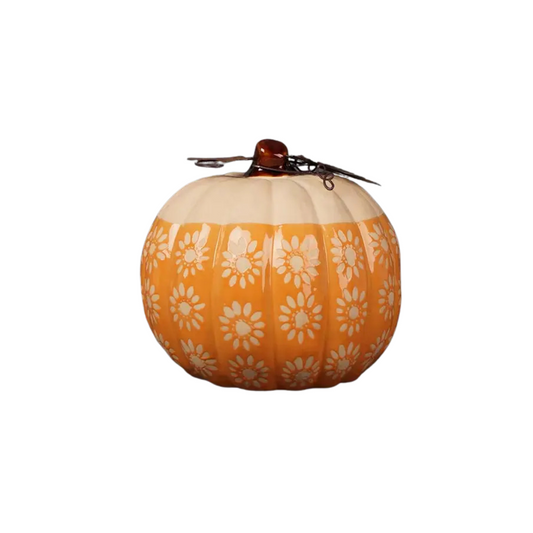 Large flowered pattern ceramic pumpkin with rustic metal leaf on top on white background