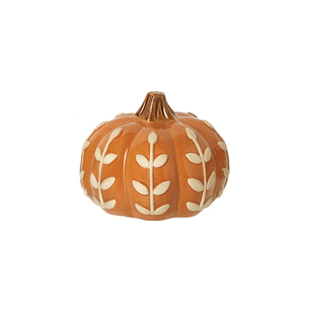 Decorative pumpkin with white leaf patterns on a white background