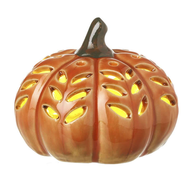 Decorative pumpkin with cut-out design on a white background