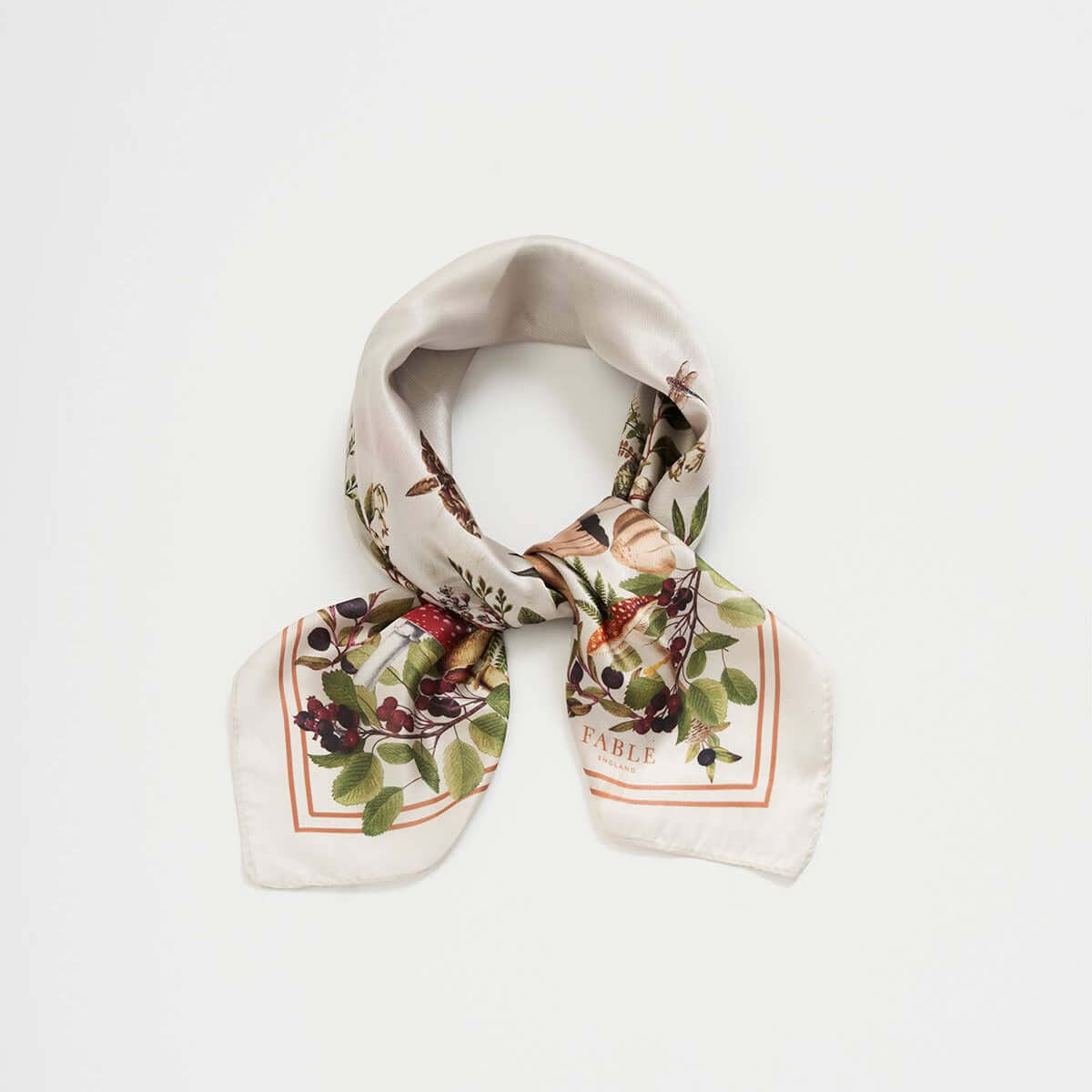 Decorative scarf with floral and bird pattern on a white background