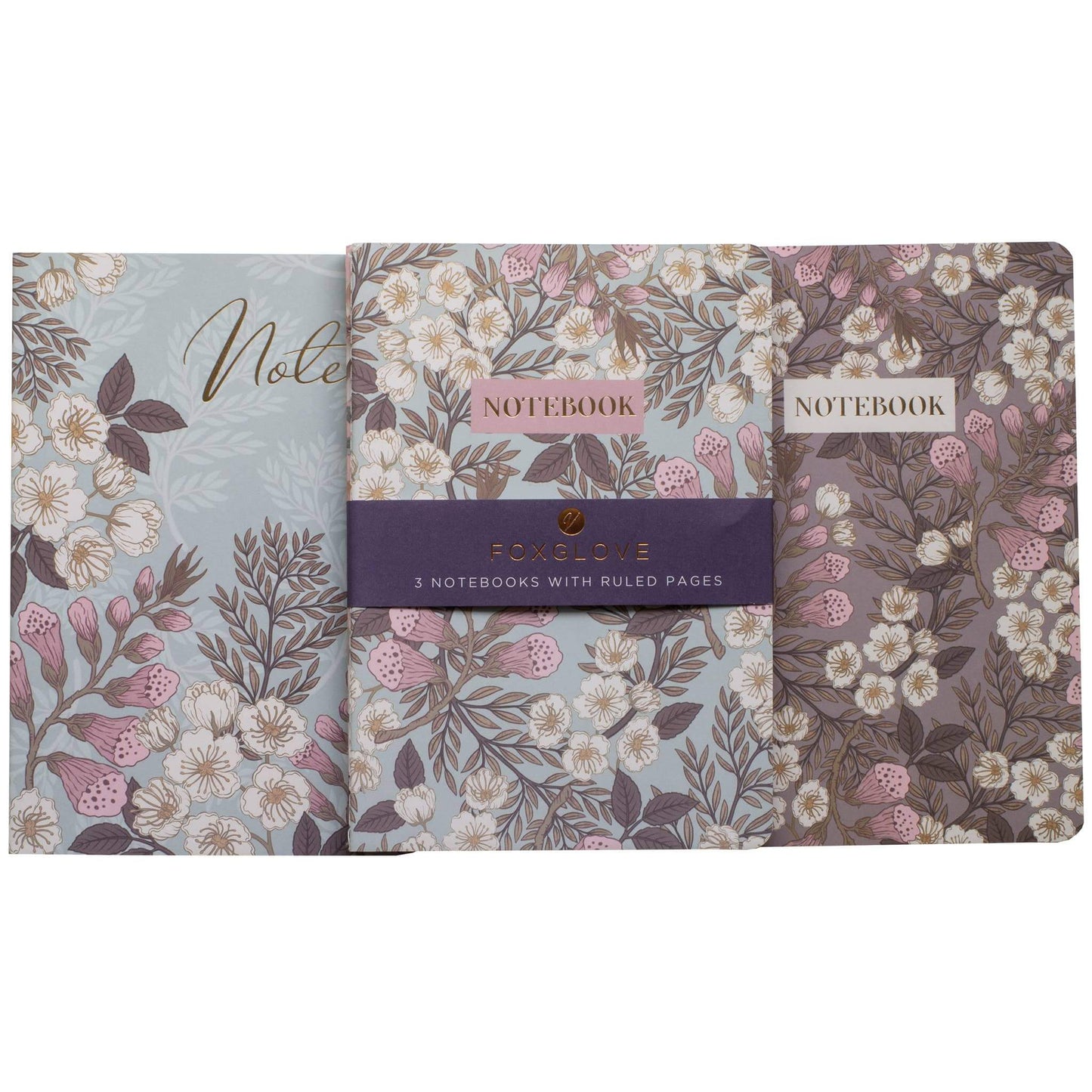Set of three floral notebooks with visible branding on a white background