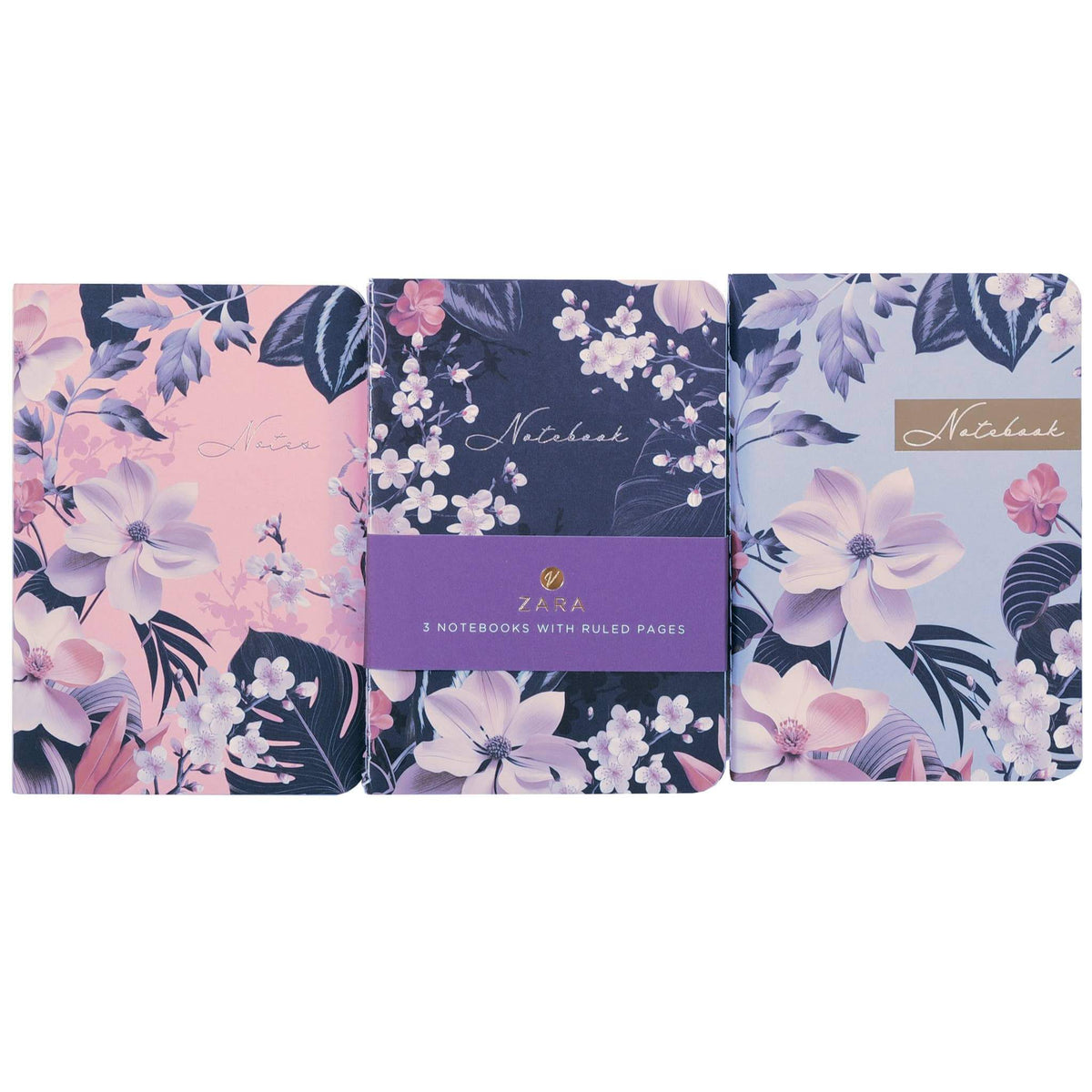 Three floral notebooks from are lined up side-by-side on a white background. The center notebook has a purple band around it, and the other two have pink and light blue covers respectively, all decorated with white and pink flowers and dark leaves.