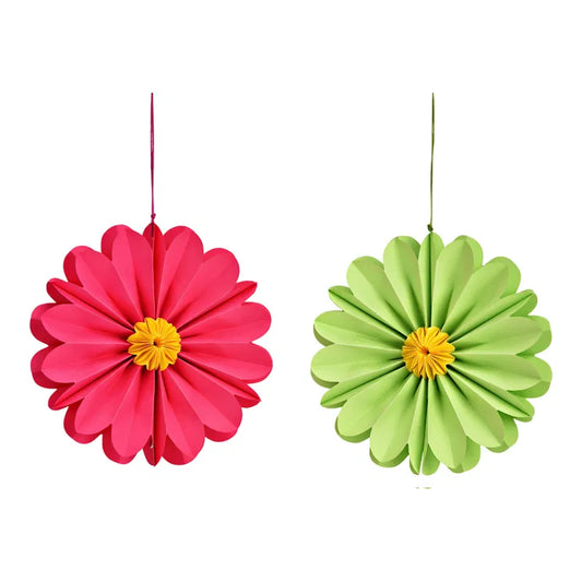 Two colorful paper flowers, one pink and one green, on a white background.