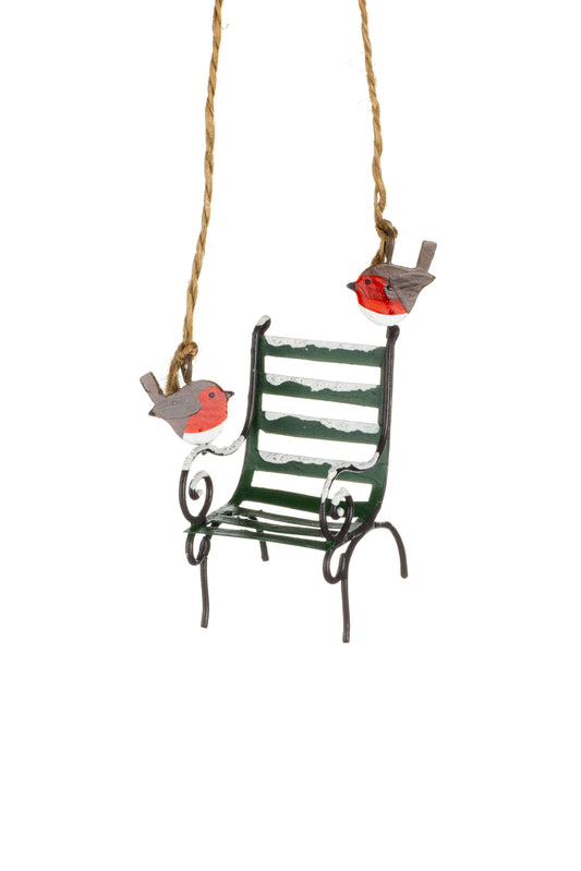 A hanging miniature garden bench ornament with three painted robin birds attached to the sides, suspended from a rope against a plain white background.