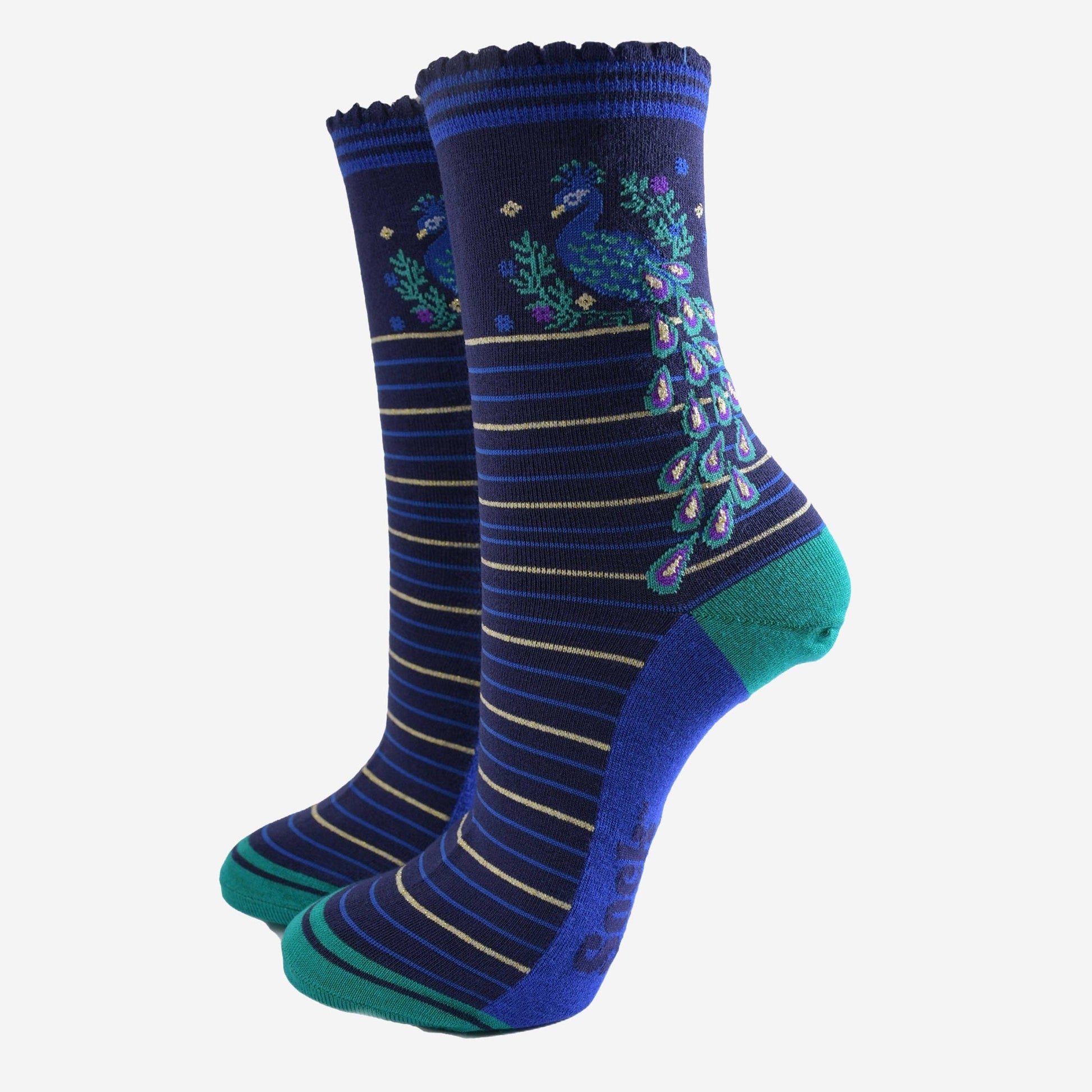Pair of blue and green socks with peacock design on a white background