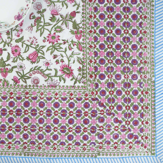 Floral and geometric patterned fabric with pink, purple, and green colors.