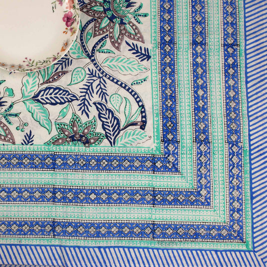 Close-up of a decorative fabric with intricate patterns and colors.
