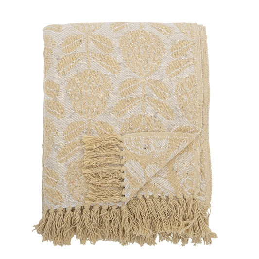Beige and white patterned throw blanket with fringes on a white background