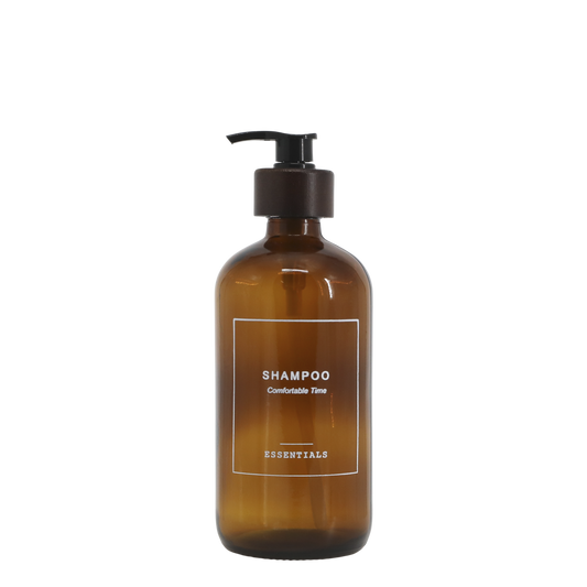Brown shampoo bottle with pump on a white background
