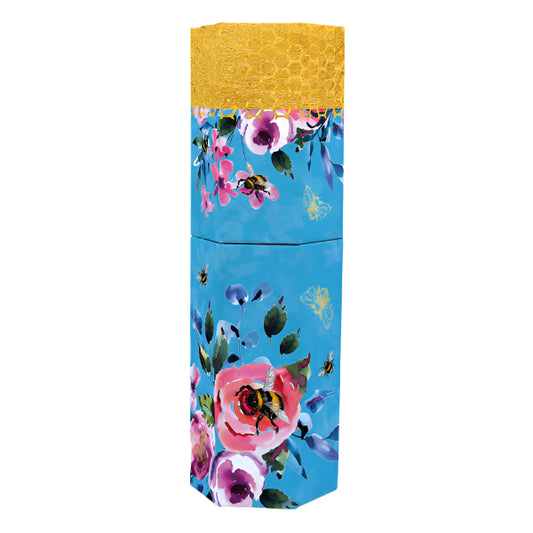 Colorful floral-patterned pot of pencils with a yellow top on a white background