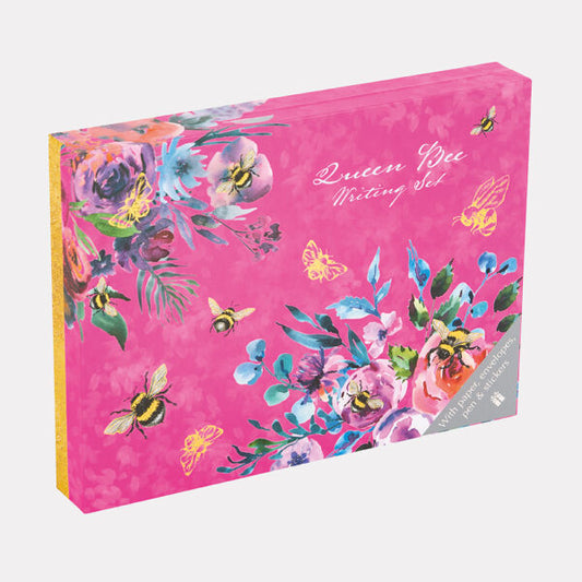 Pink writing set box with floral and bee design on a white background