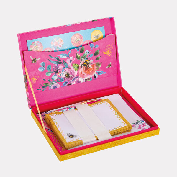 Floral notepad set in a decorative pink and yellow box on a white background