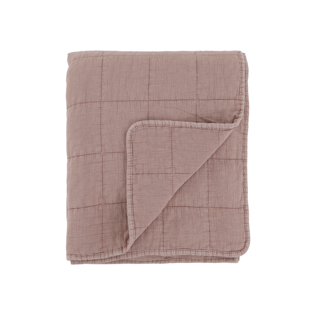 Dusky pink taupe quilt on white background