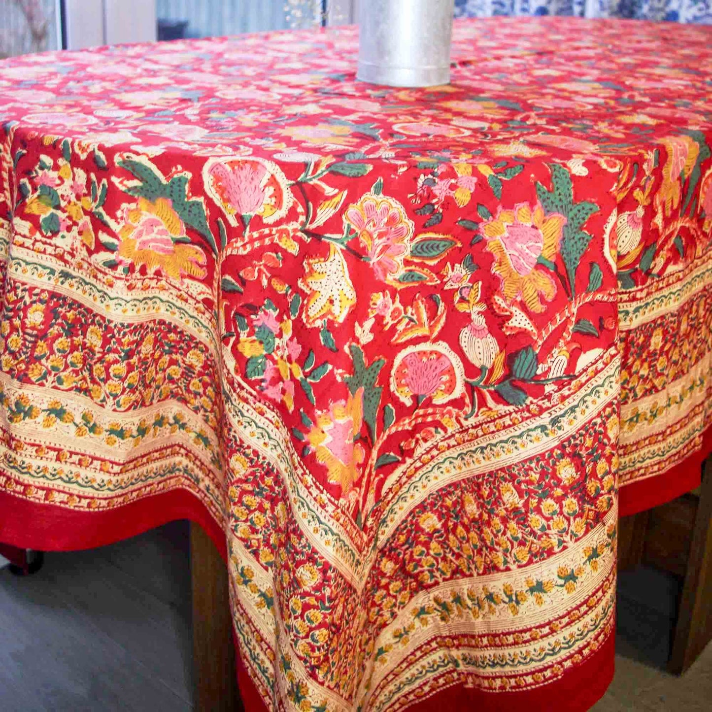 Colorful floral-patterned tablecloth on a wooden table