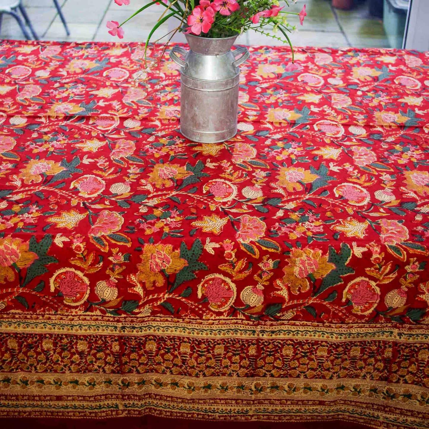 Decorative tablecloth with floral pattern on a table