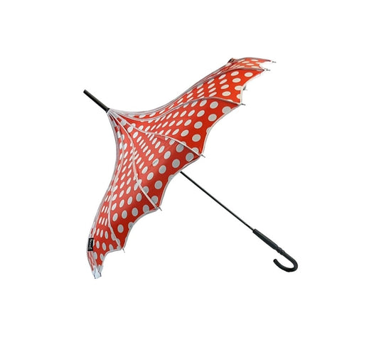 Red umbrella with white polka dots on a white background