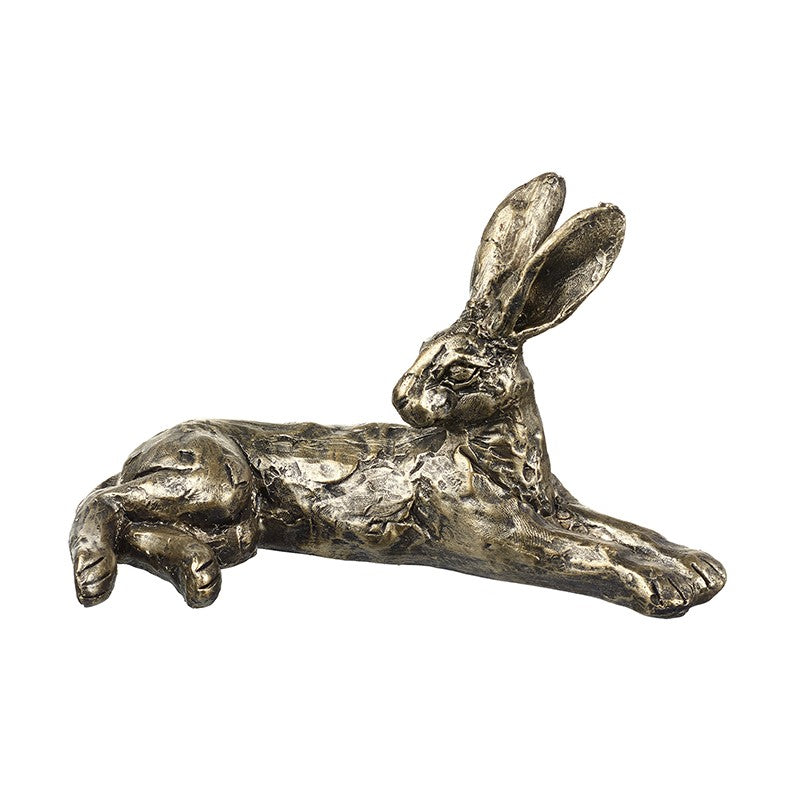 Bronze sculpture of a lying rabbit on a white background