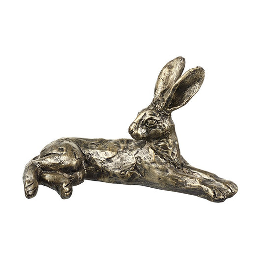 Bronze sculpture of a lying rabbit on a white background
