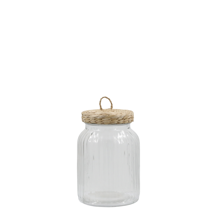 Ribbed glass storage jar with wicker lid on white background