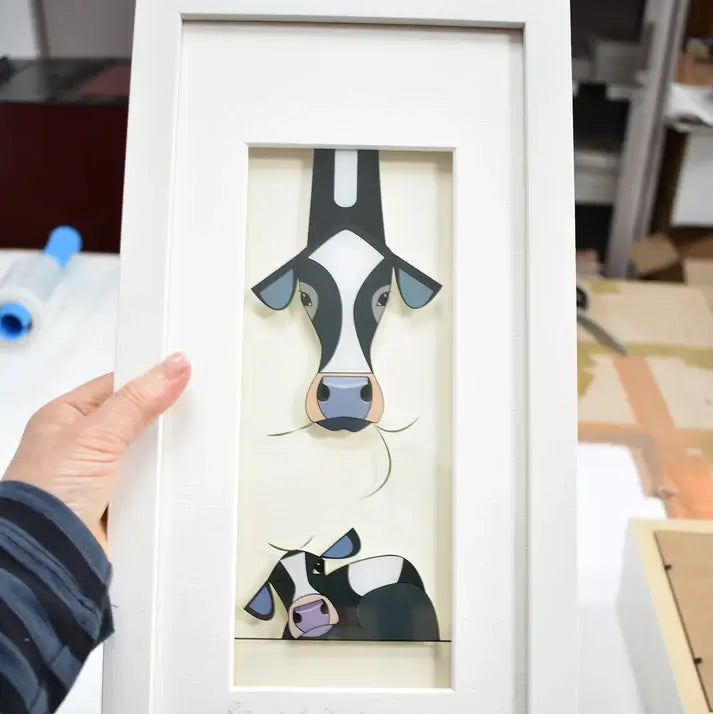Rise & Shine. Image of cows being held