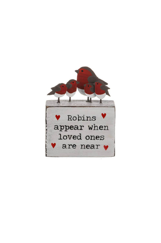 Decorative sign with red robin birds and text on a white background