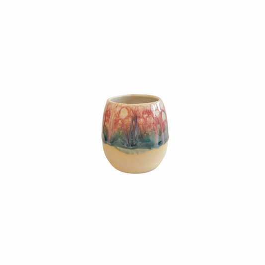 Pretty handmade small stoneware beaker glazed in pink, white and green glaze.  Inspired by Cherry Blossoms. Made in Northern Ireland