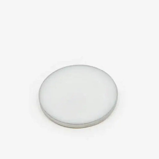 Salted Skin solid perfume balm disc on a white background