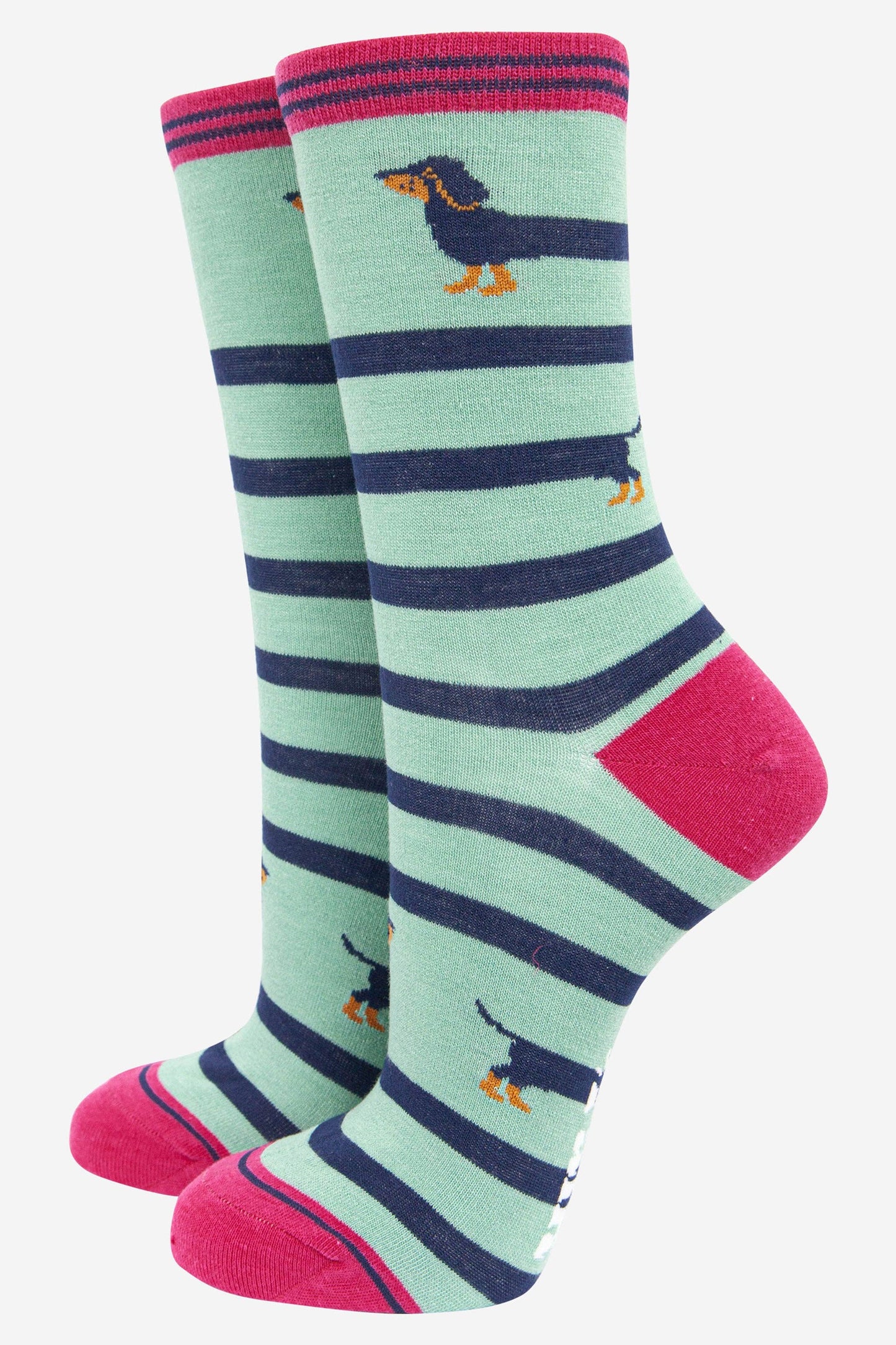 Pair of socks with green, navy, and pink stripes and dachshund designs on a white background