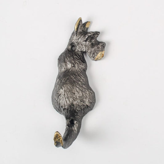 Decorative metal scottie dog wall hook on a white background