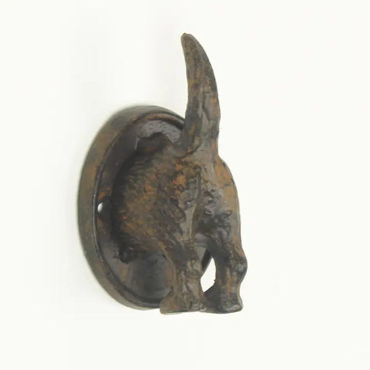 Decorative metal wall hook with a deer design on a white background