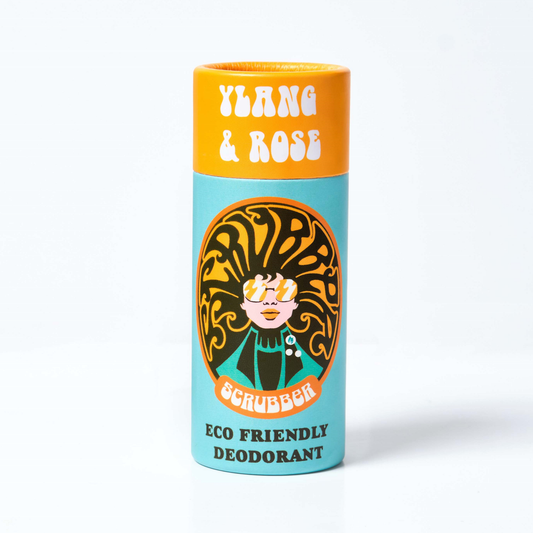 Deodorant stick labeled 'Ylang & Rose Eco Friendly Deodorant' with brand logo and illustration of a character on the packaging.