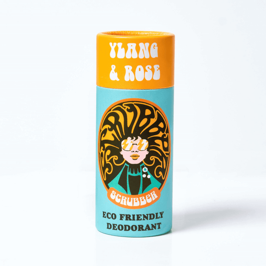 A cylindrical deodorant stick labeled 'Ylang & Rose Eco Friendly Deodorant' with a decorative design featuring a woman's face and text.