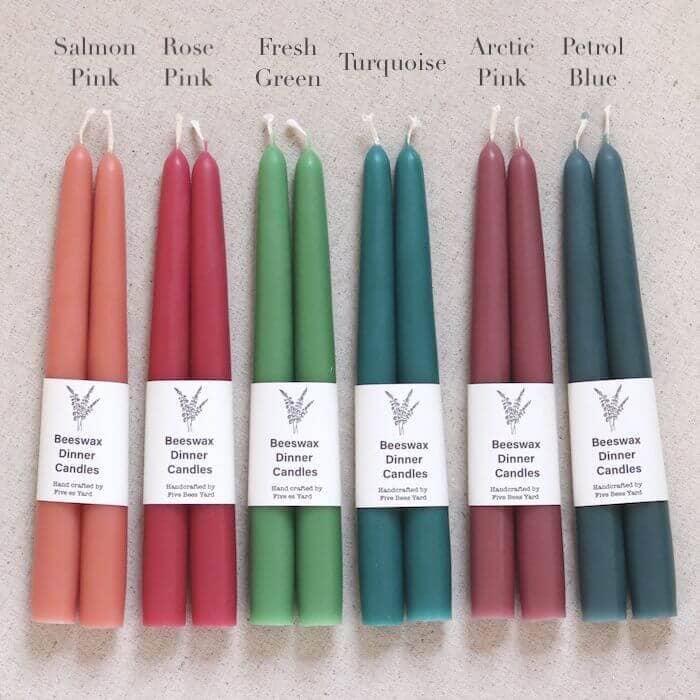 Set of Beeswax Dinner Candles in various colors on a neutral background