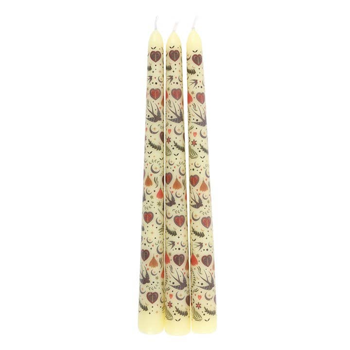 Three patterned candles on a white background