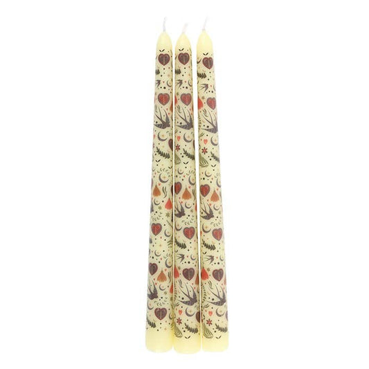 Three patterned candles on a white background