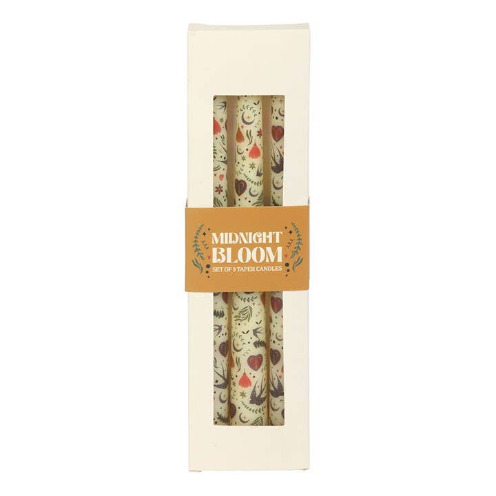 Set of two candles in a decorative box with 'Midnight Bloom' branding.