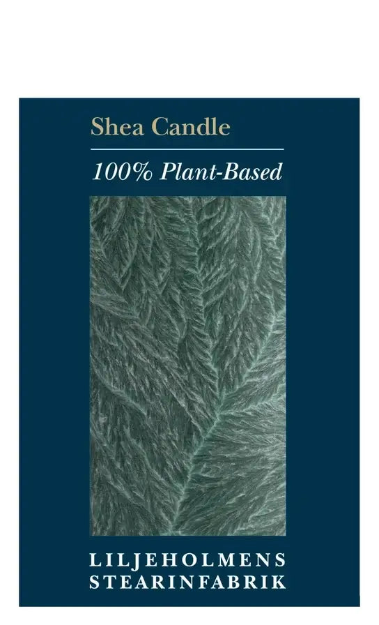 A dark teal rectangular product card for a Shea Candle, featuring a central close-up photo of a green leaf texture, with text reading 'Shea Candle', '100% Plant-Based', and 'LILJEHOLMENS STEARINFABRIK' on a white background.