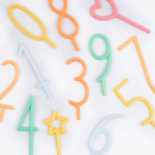 Colorful number-shaped straws on a white background