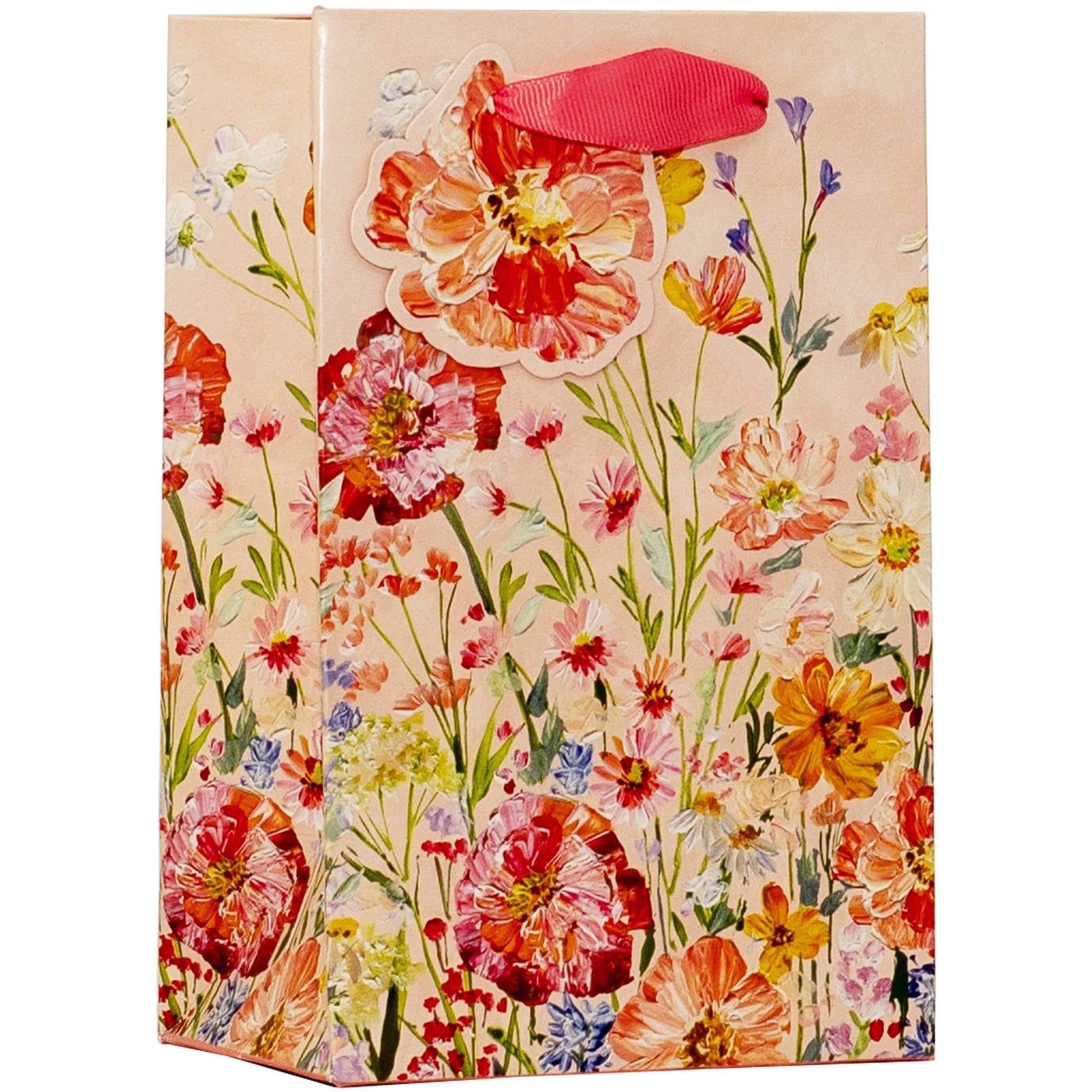 Floral-patterned gift bag with a pink ribbon on a white background