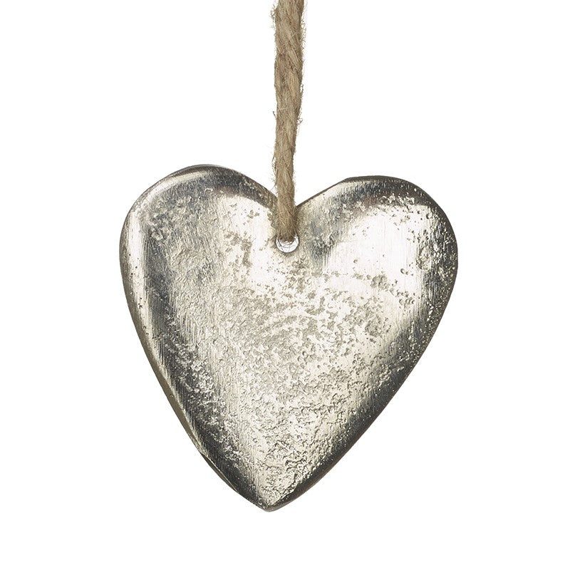 Silver heart-shaped hanging ornament on a white background