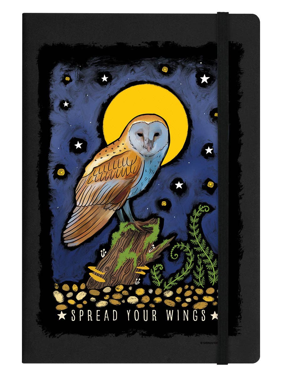 Black notebook with an owl illustration on a dark blue background