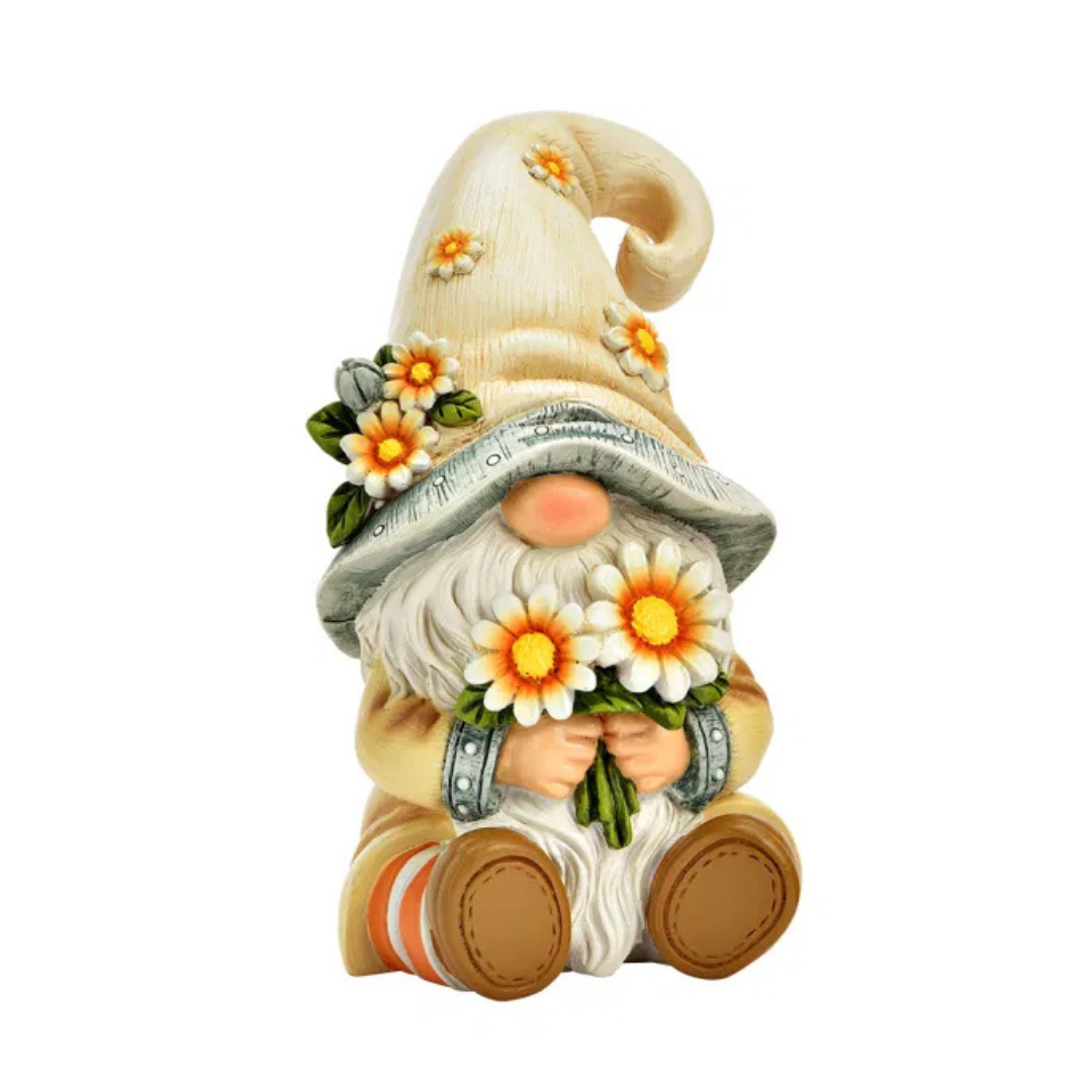 Decorative gonk figurine with a floral hat and flowers in its hands on a white background