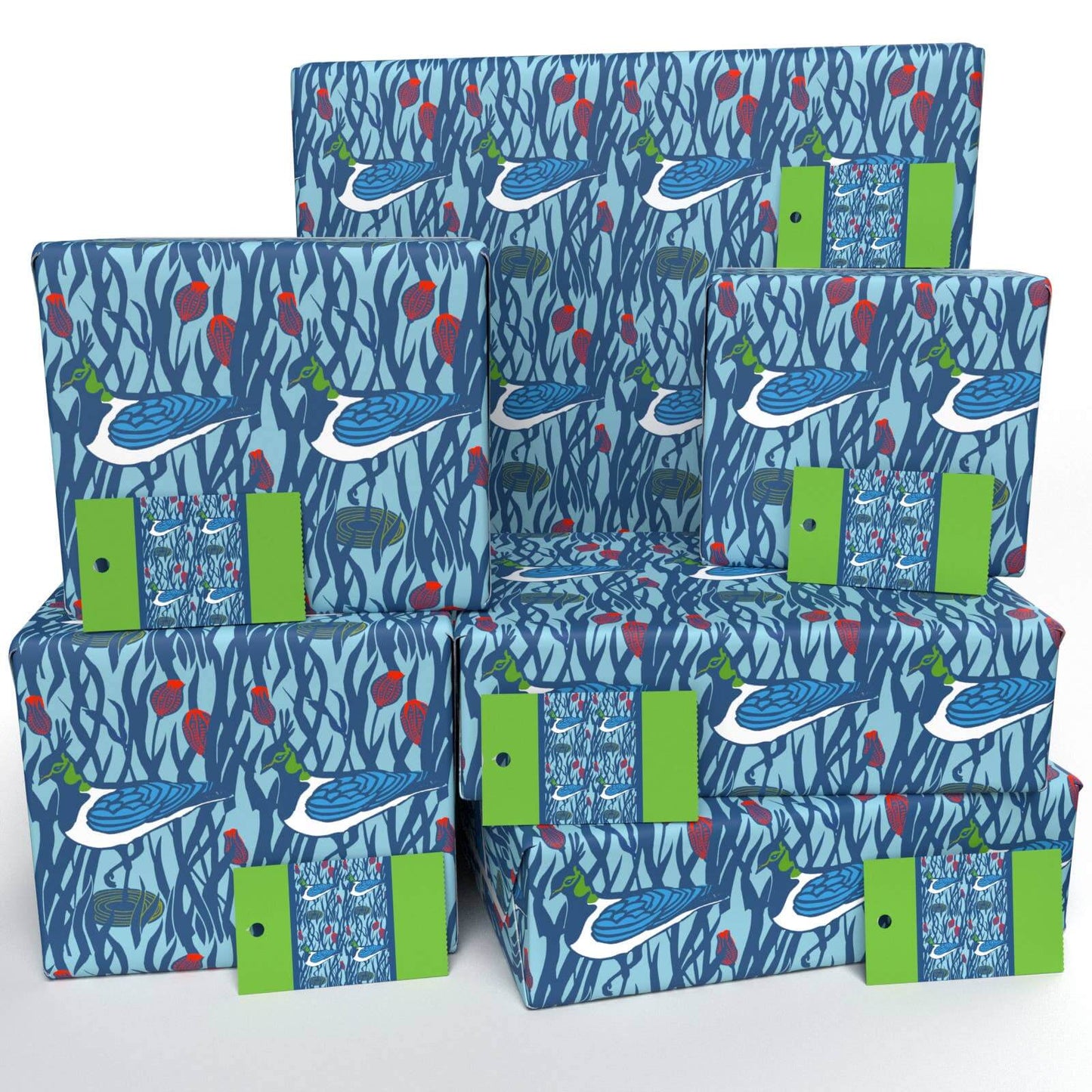 Stacks of wrapping paper with a blue and green floral pattern and a label indicating 'Lapwings' on the lower right corner.