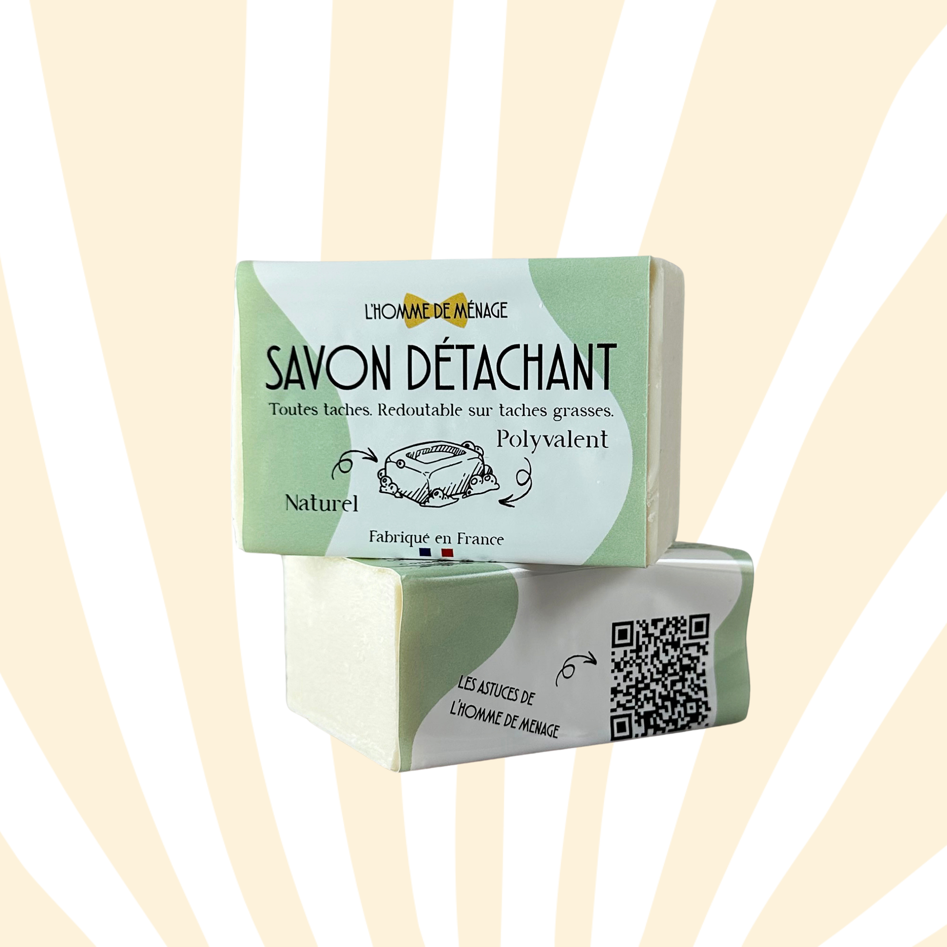 Bar of soap with packaging labeled 'Savon Detachant' on a beige background