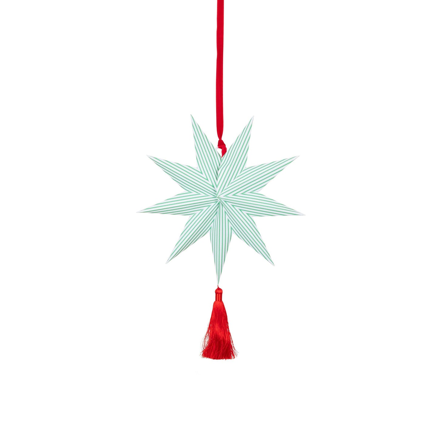Decorative star ornament with red tassel on a white background
