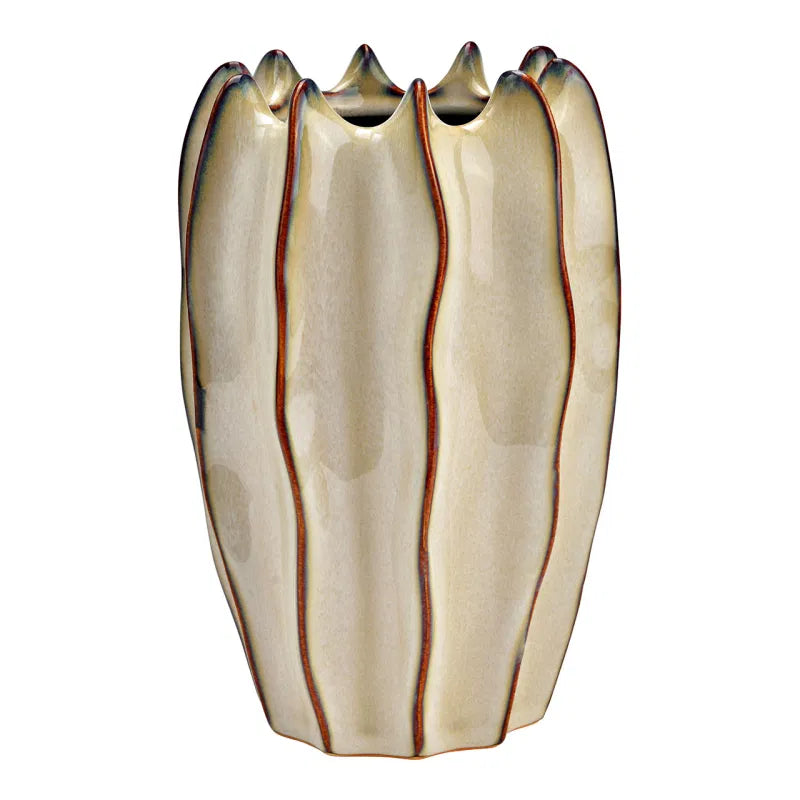 Decorative vase with wavy design on a white background